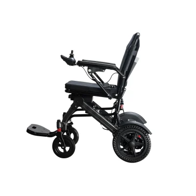 Side view of a modern electric wheelchair featuring a black lightweight frame, cushioned seat and backrest, a large perforated rear wheel, front suspension wheel, foldable footrest, and right-arm joystick control.