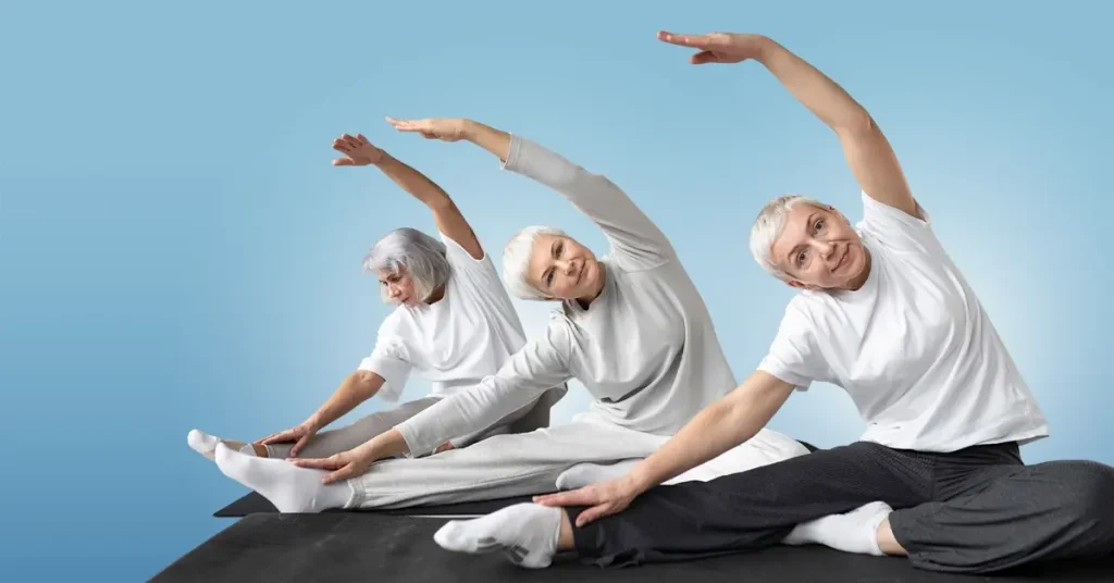 Current image: Older adults taking part in an easy mobility exercises class in a sunlit, comfortable community space, illustrating accessible group fitness for seniors of all mobility levels and encouraging an active, social, and healthy lifestyle.