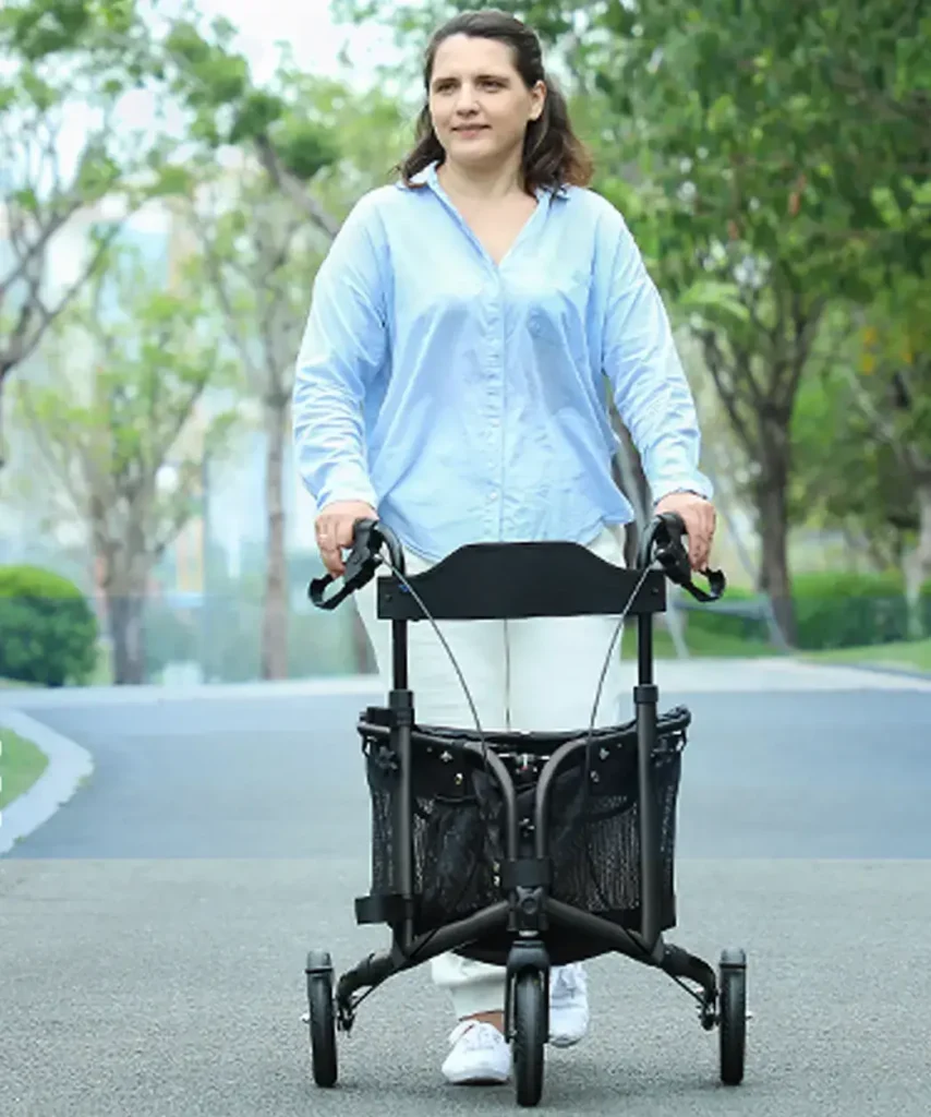 A person using a blue rollator walker with wheels, a seat, and a storage basket outdoors.